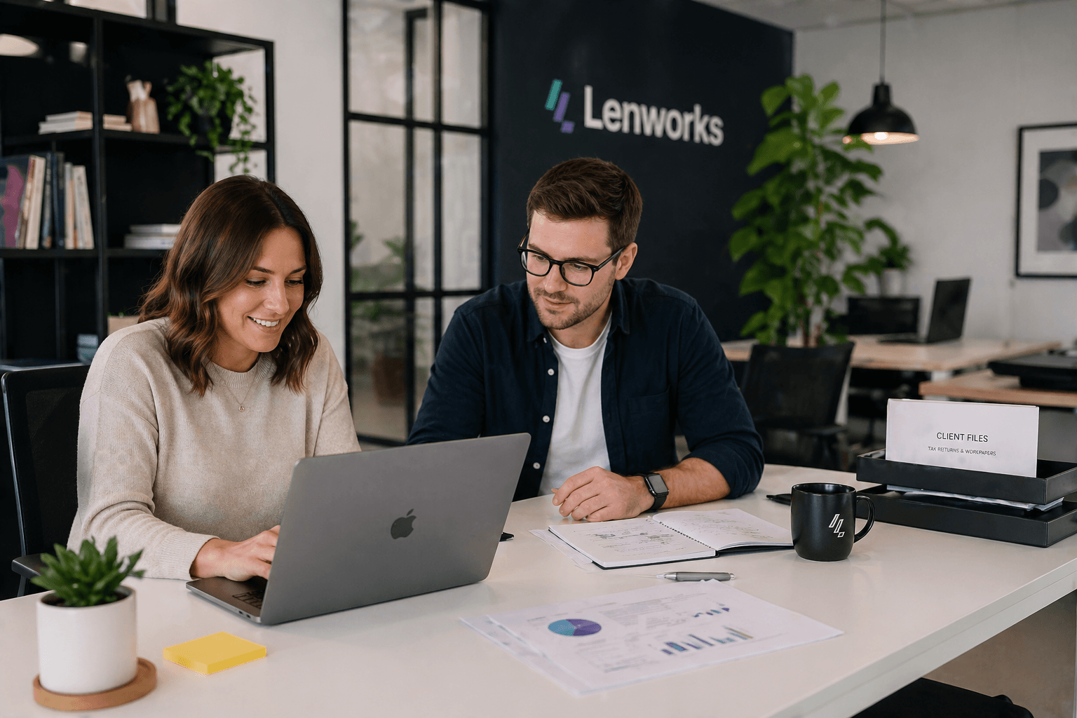 Accountant working on laptop managing their accounting firm tech stack at a modern office desk